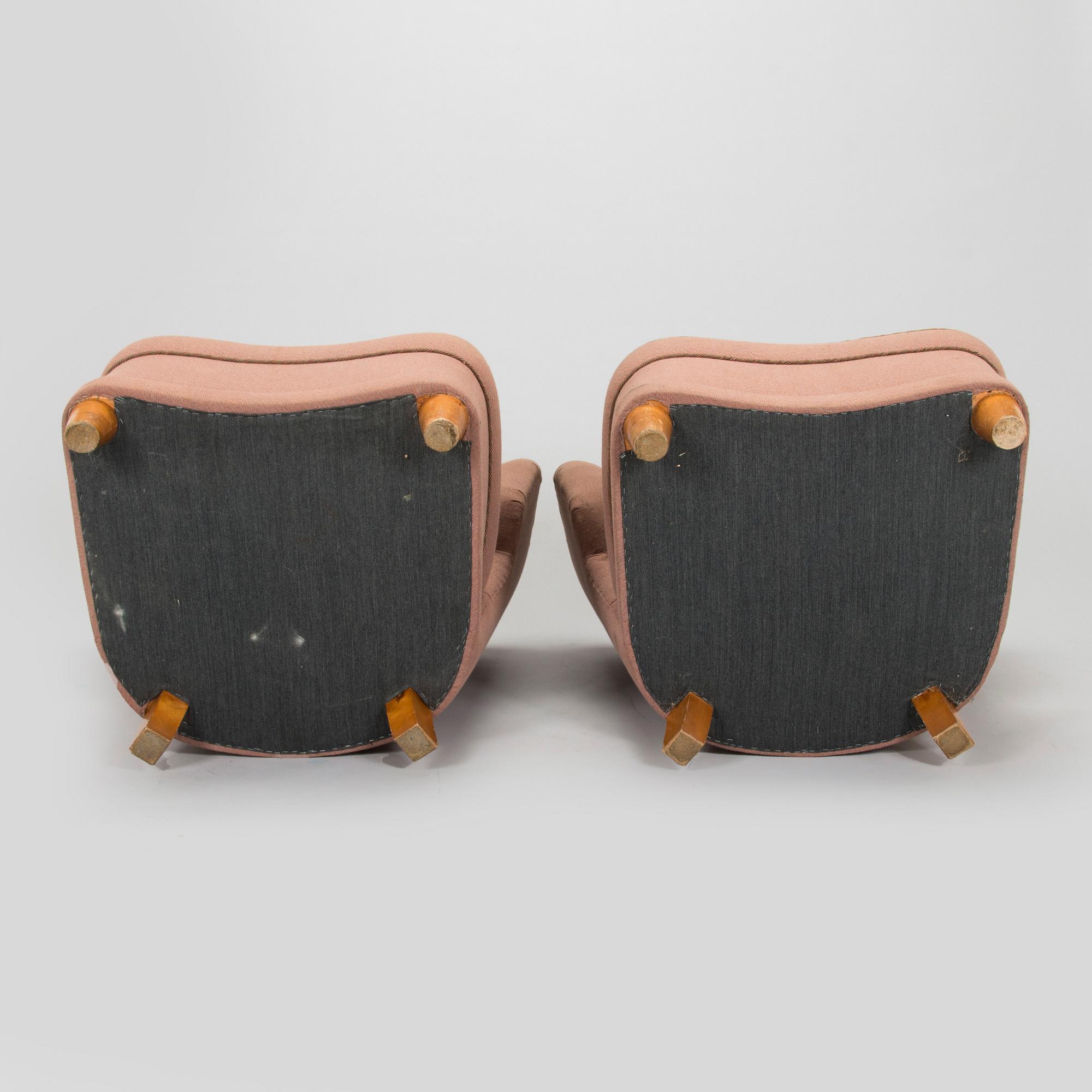 A pair of mid-20th century armchairs.