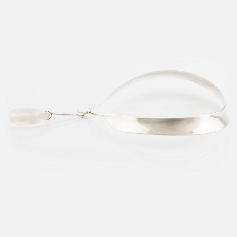 Vivianna Torun Bülow-Hübe, a neck ring no. 160 with pendant no. 131 in rutilated quartz, sterling silver, for Georg Jensen, Denmark.