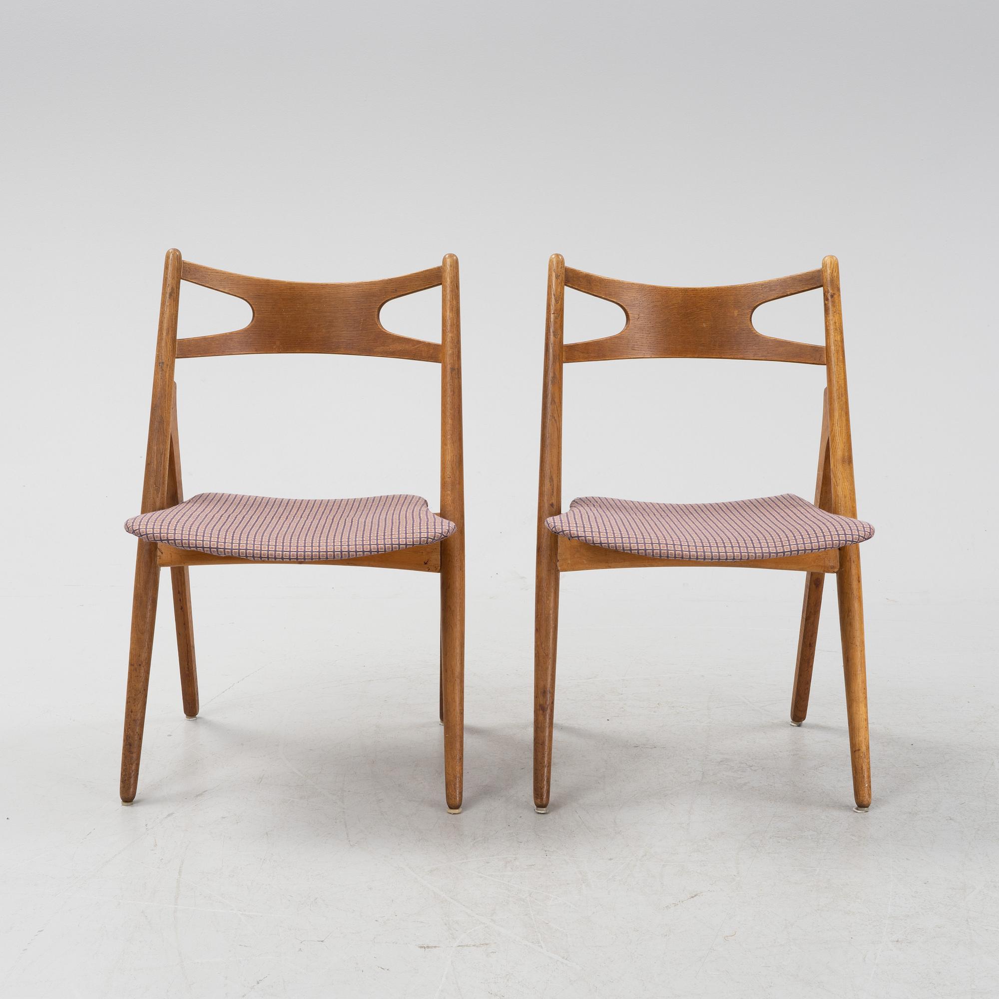 A set of six model CH 29 'Savbukstolen' by Hans J Wegner, designed 1952.