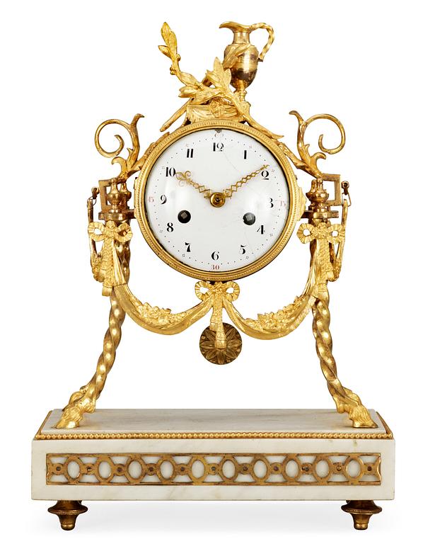 A Louis XVI late 18th century gilt bronze and marble mantel clock.