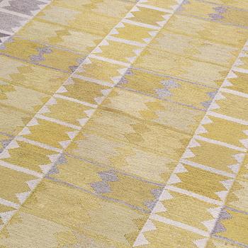 A CARPET, "Liljorna, gul", flat weave, designed by Ingrid Dessau for Hemslöjden Borås., around 216 x 165 cm.