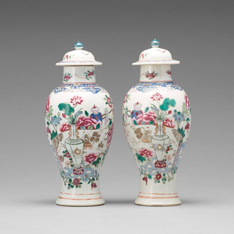 A pair of famille rose vases with covers, Qing dynasty, Qianlong (1736-95).