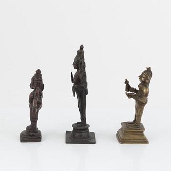 A group of three Indian bronze figures and an ewer, 20th century.