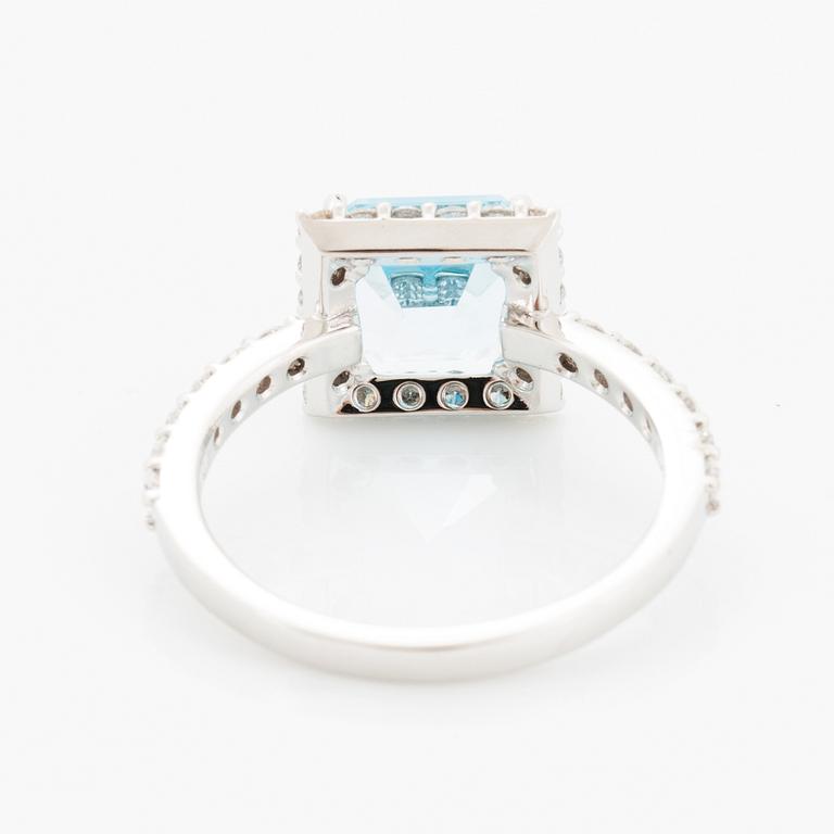 Blue topaz and brilliant-cut diamond ring.