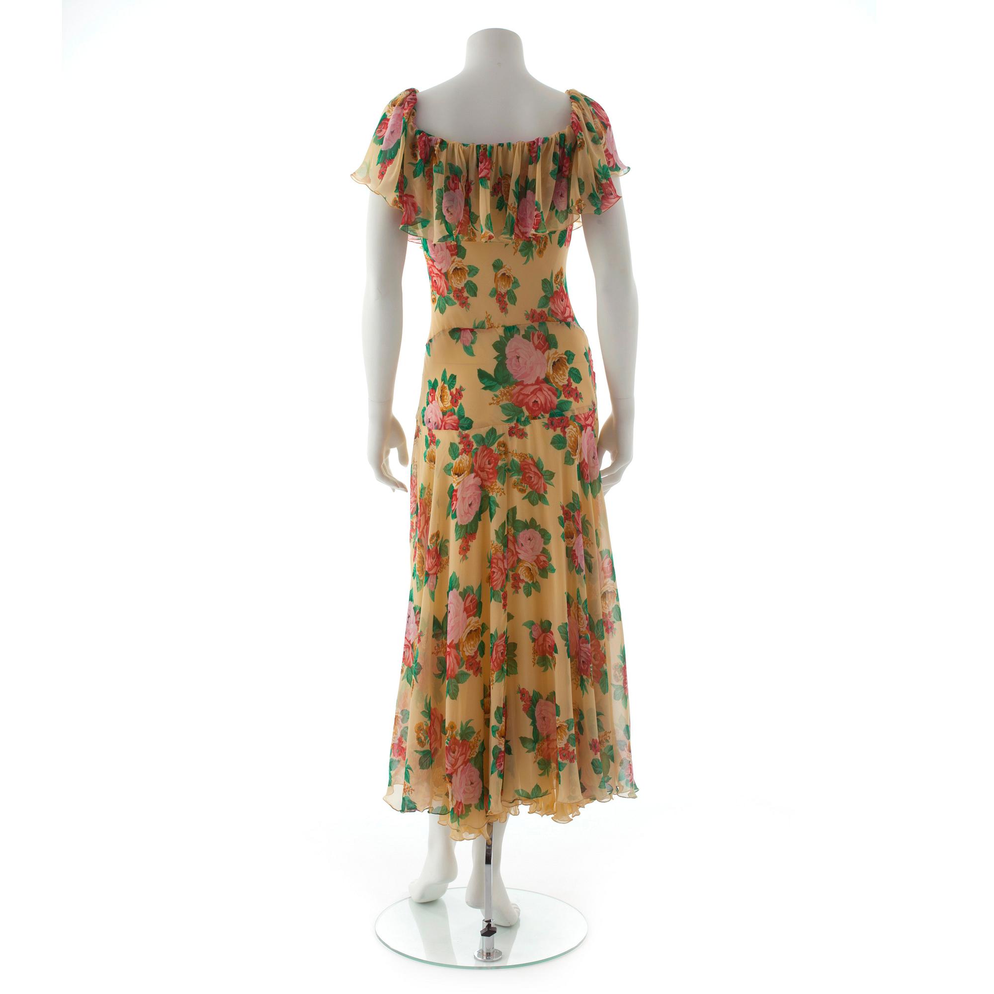 MOSCHINO COUTURE, a flower printed yellow silk dress.