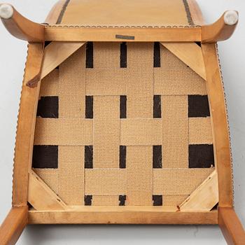 Carl Malmsten, a set of twelve, mahogany and leather chairs. Åfors Möbelfabrik.