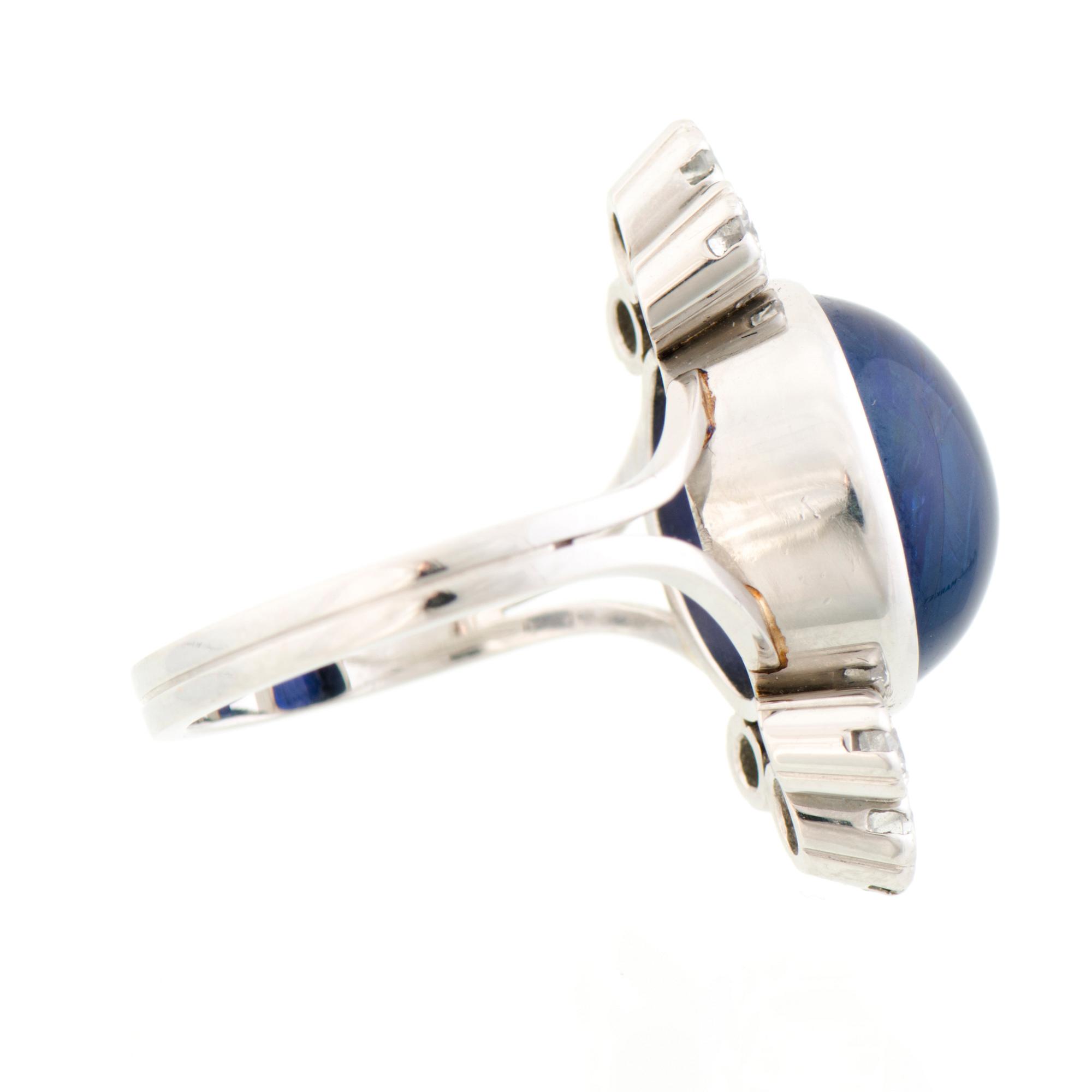 A RING, cabochon cut sapphire, brilliant cut diamonds, platinum. A. Tillander.