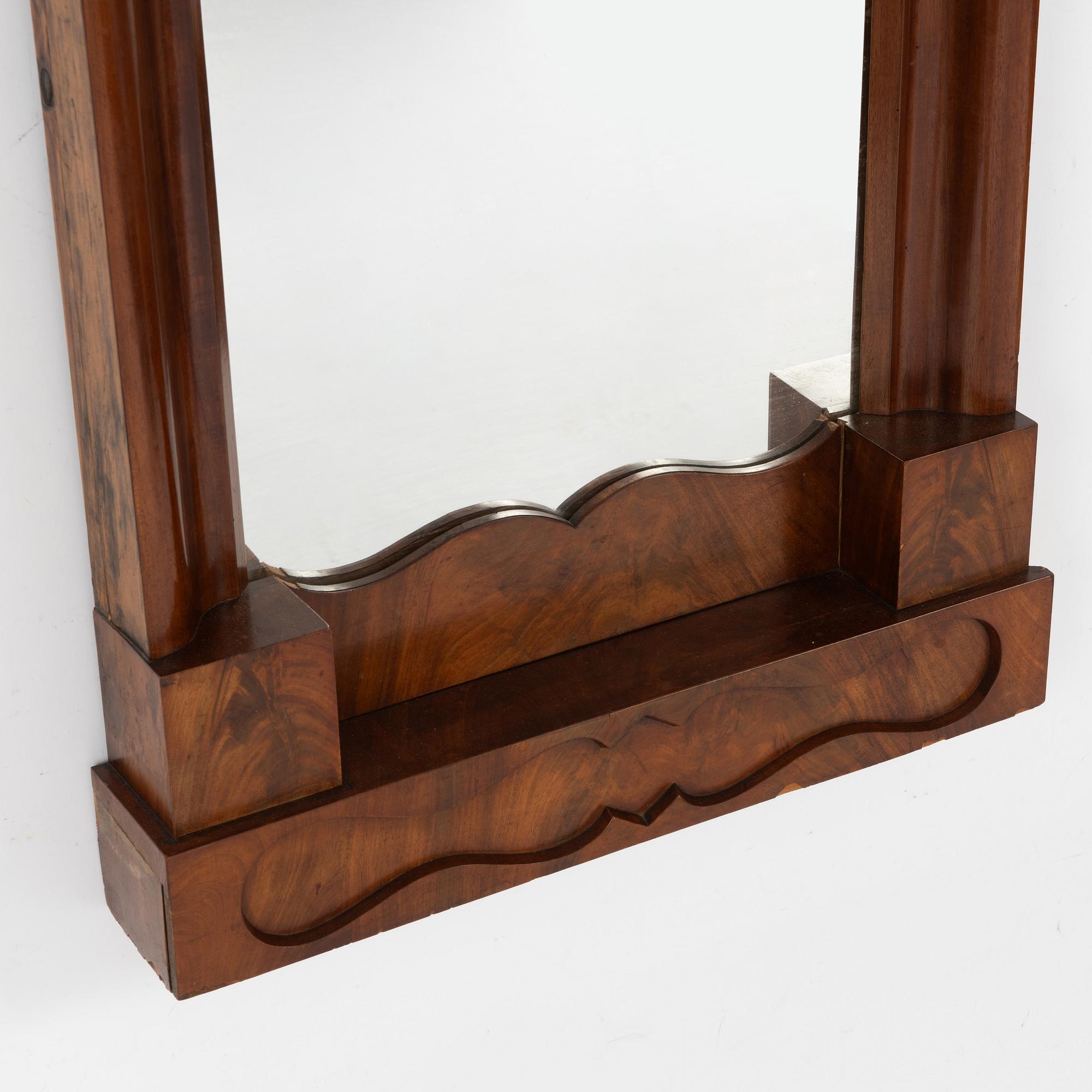 An Empire mirror, first half of the 20th Century.