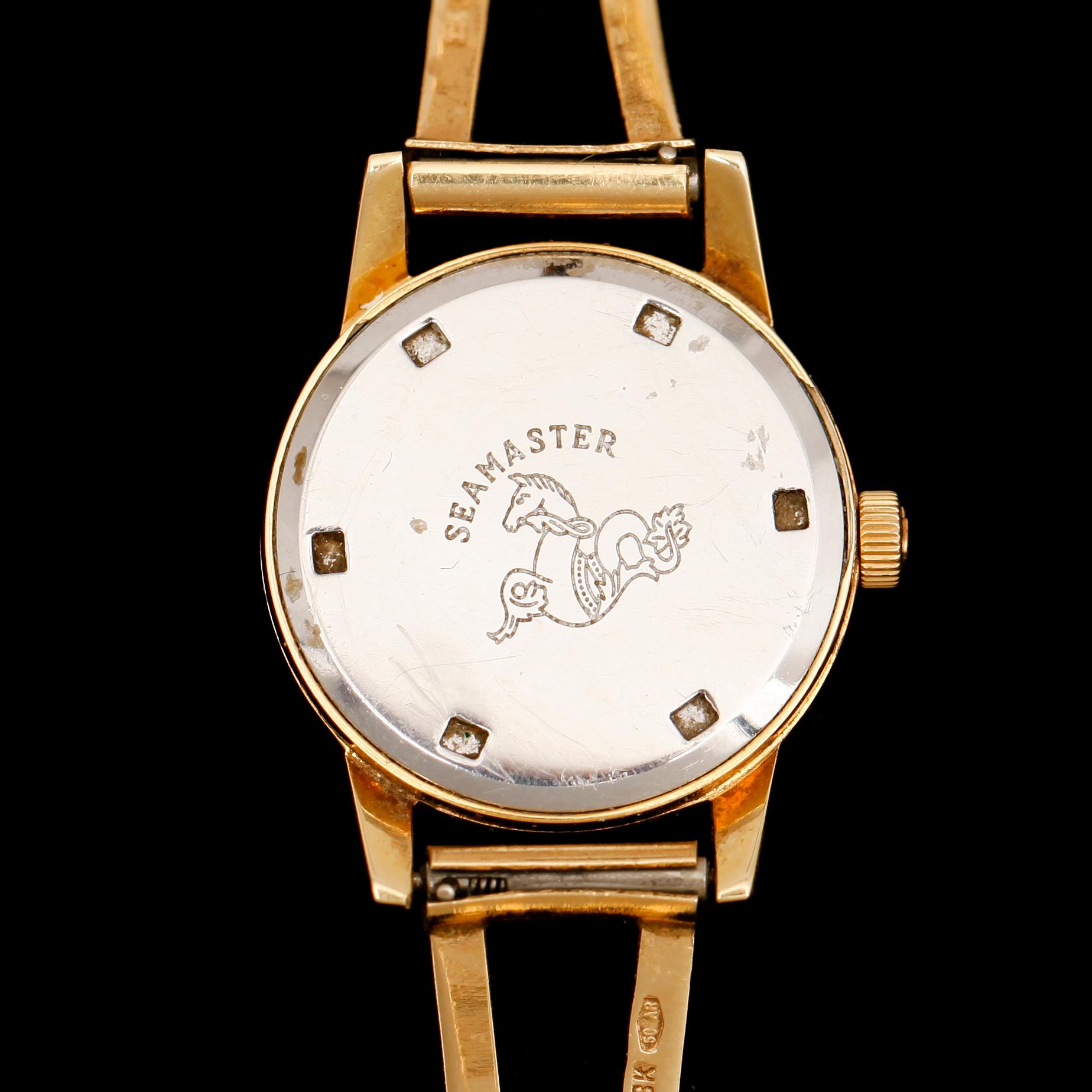 DAMARMBANDSUR, guld på stål, Omega Seamaster, stelt armband 18 k guld. Tot vikt ca 11 g.