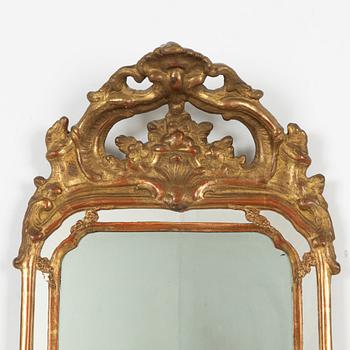 A pair of Swedish rococo two-light girandole mirrors, later part 18th century.