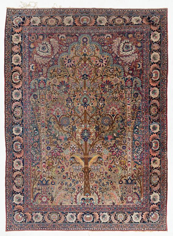 An antique/semi-antique Kerman carpet c 415 x 305 cm.