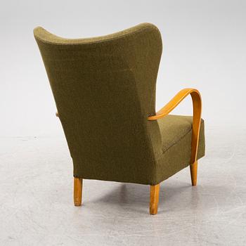 A 1940's wingback armchair.