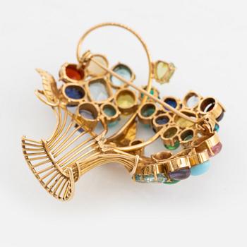 An 18K gold flower basket broosch with gemstones and imitation.