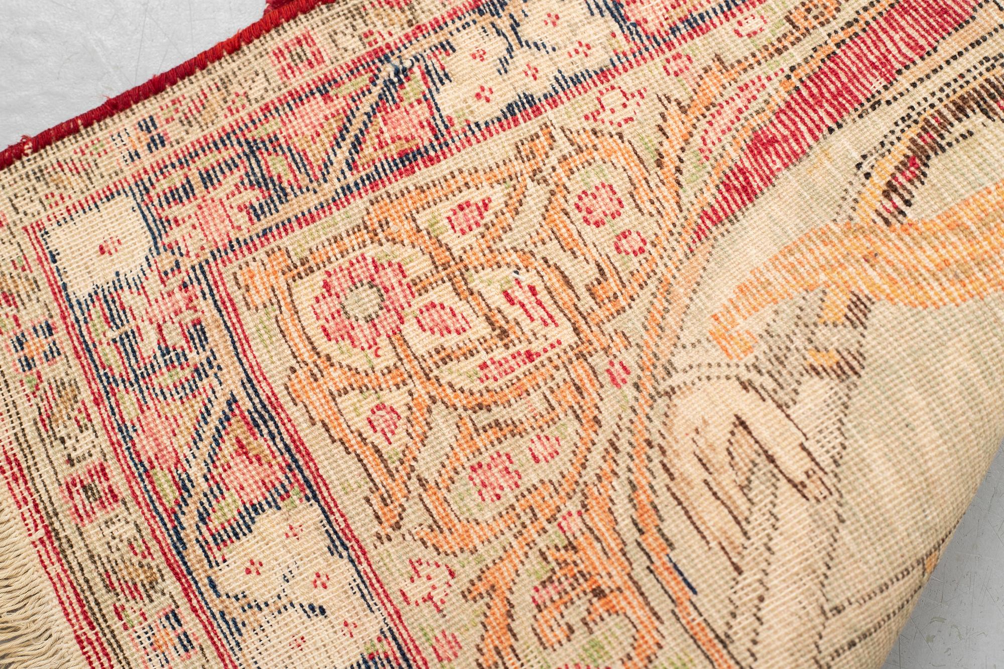 A rug, Antique Kerman laver, ca  68 x 45 cm.