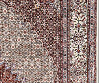 A part silk Moud carpet, approximately 350 x 252 cm.