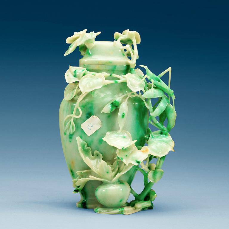 A Chinese elaborately carved nephrite vase with cover, 20th Century.