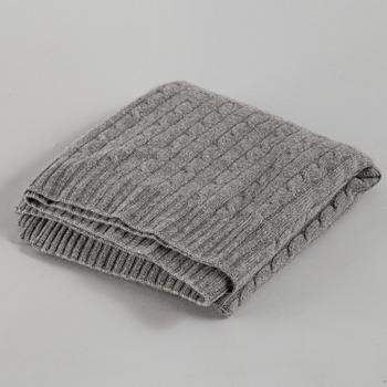 A cashmere blanket by Ralph Lauren.