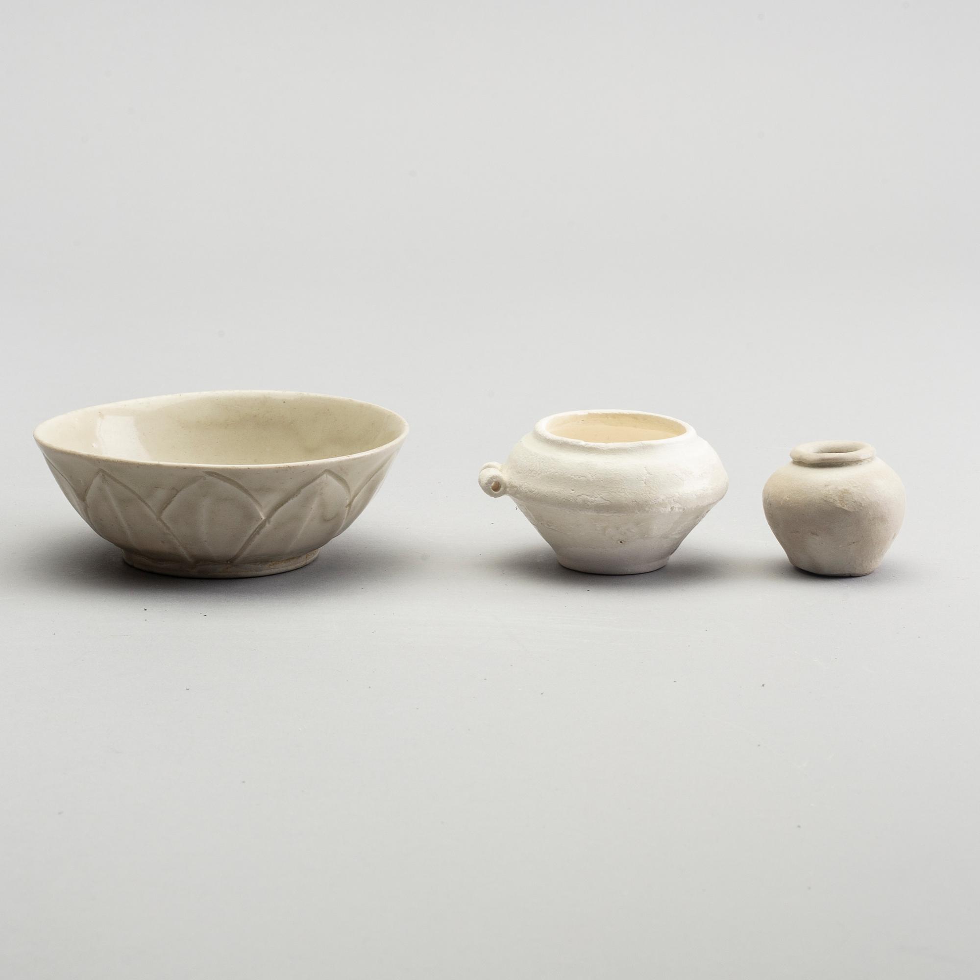 A group of white glazed South East Asian vases and bowls, partly 16/17th Century.