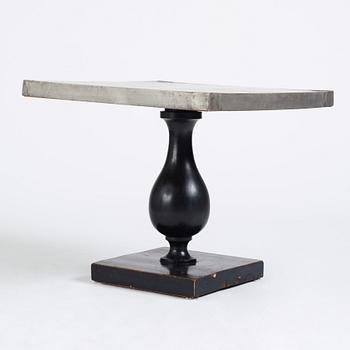 Uno Åhrén, a black lacquered table with a pewter top by Nils Fougstedt, Svenskt Tenn ca 1930. Alva & Gunnar Myrdal Collection.