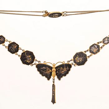 A silver-plated, gilded and lacquered metal parure from Japan, first half of the 20th century.