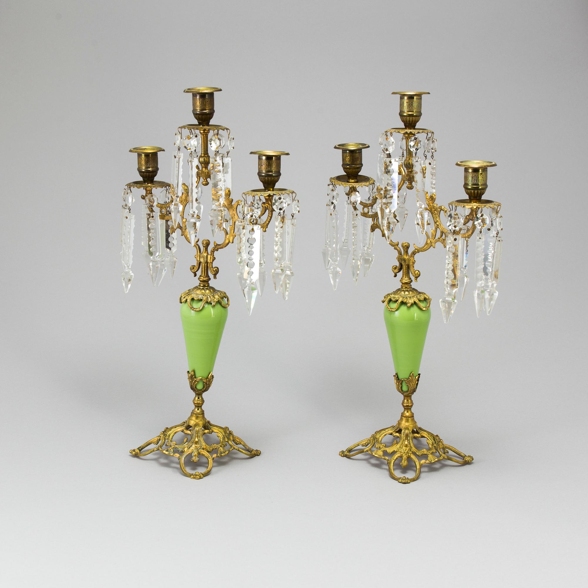 A pair of late 19th Century gilt candelabra.