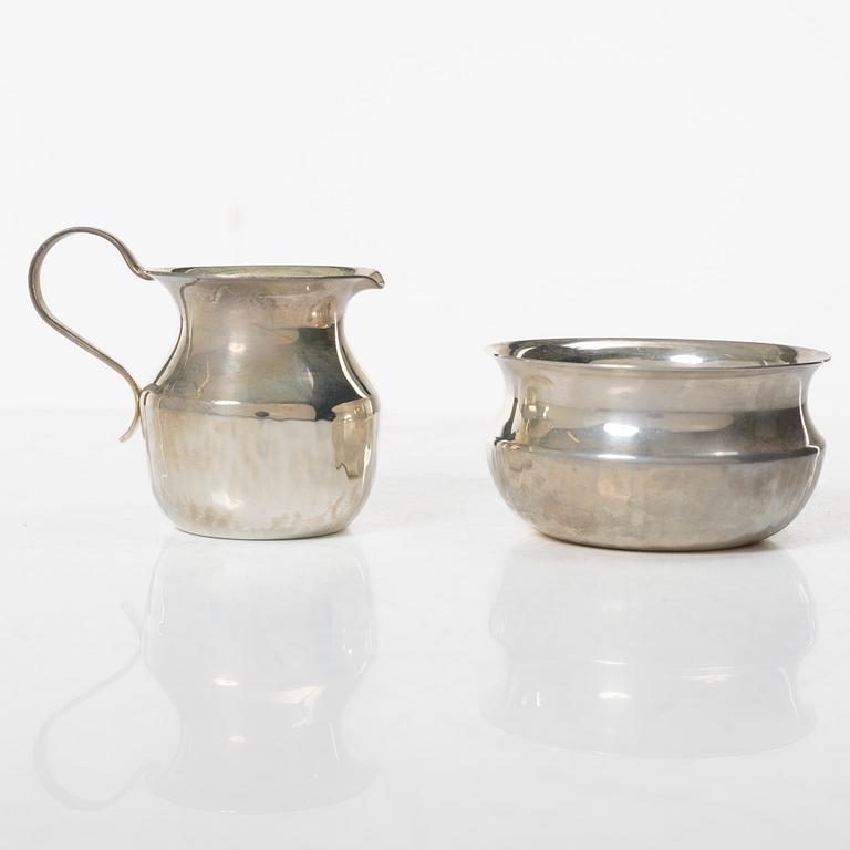 a silver creamer and sugar bowl, designed by Christian, Gewe Silvervarufabriken Ab, Malmö, Sweden, 1974-75.