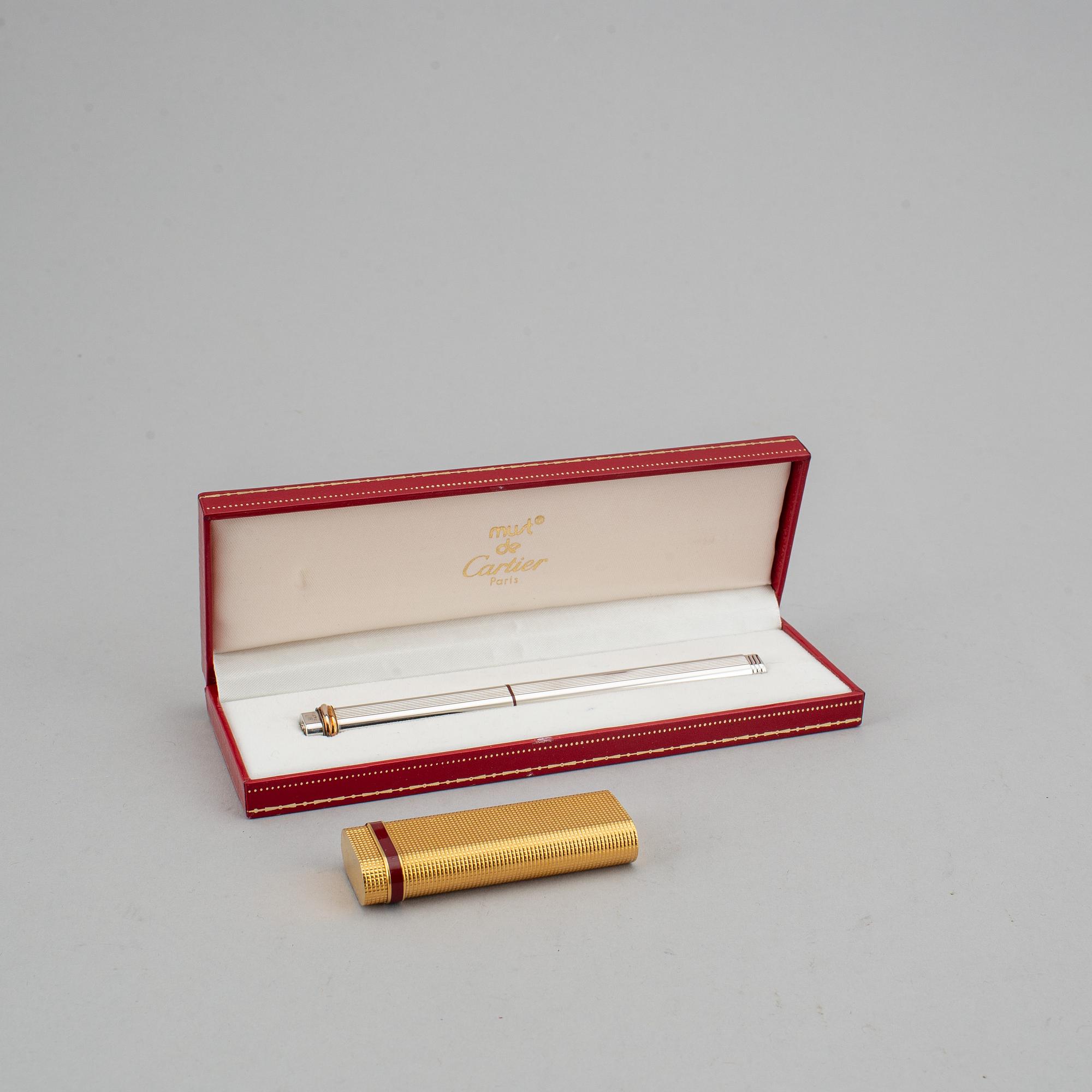 A Cartier lighter and pen.