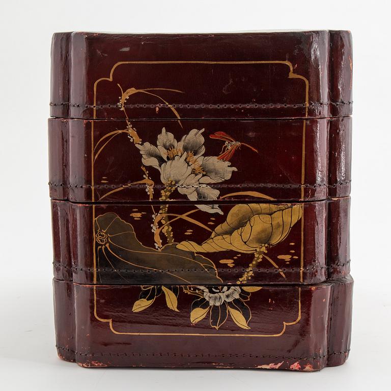 A painted Japanese four tiered box, 20th Century.