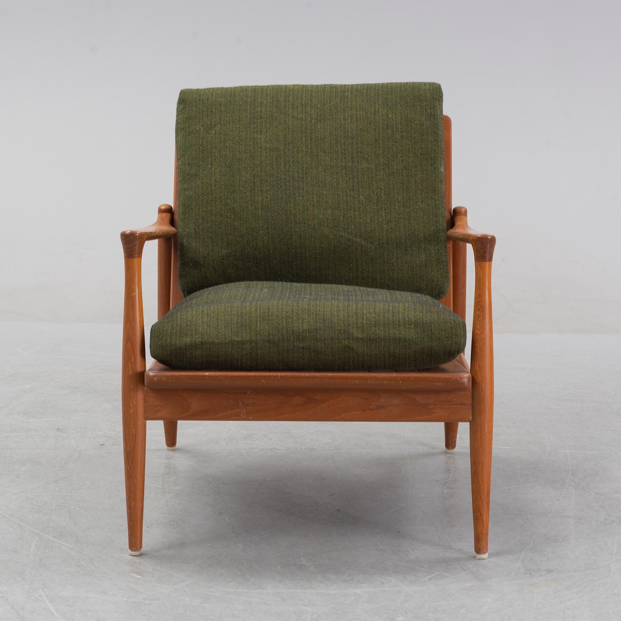 A 1950's/60's teak and oak easy chair.