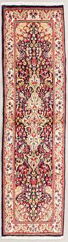 An old Kirman carpet 272x76 cm.
