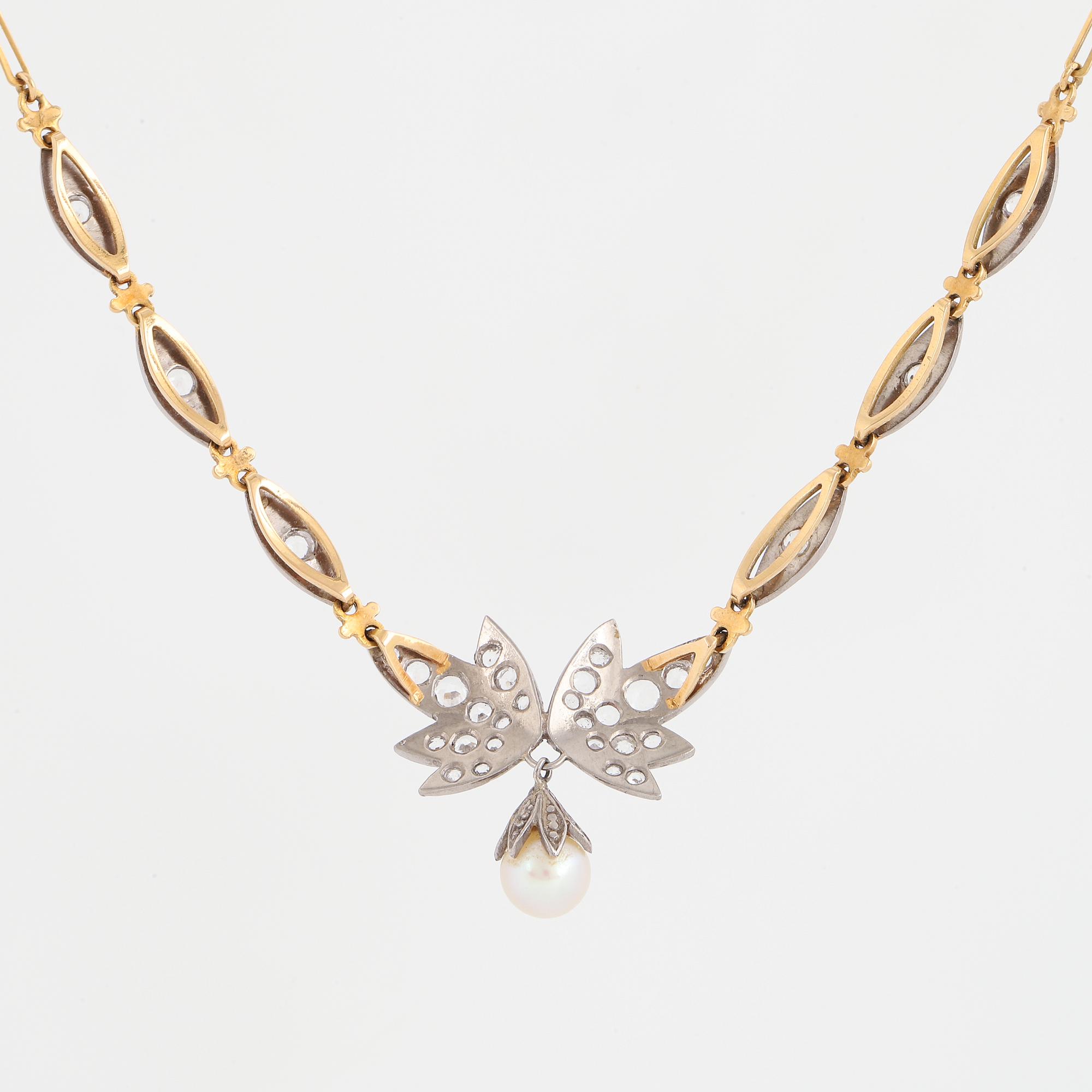 18K gold necklace with white stones and pearl.
