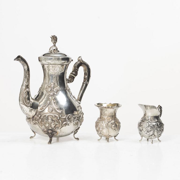 A silver Rococo style coffee pot, creamer and sugar bowl, Swedish import mark of Gewe Silvervarufabriken Ab, Malmö, 1977.