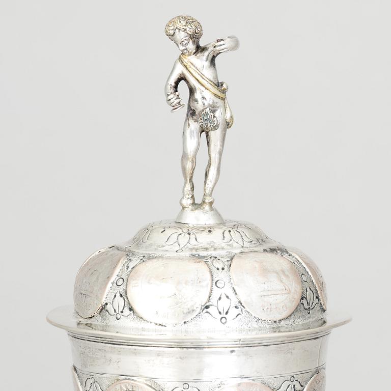 An 19th century parcel-gilt silver cup with lid, unidentified makers mark, probably Nürnberg.
