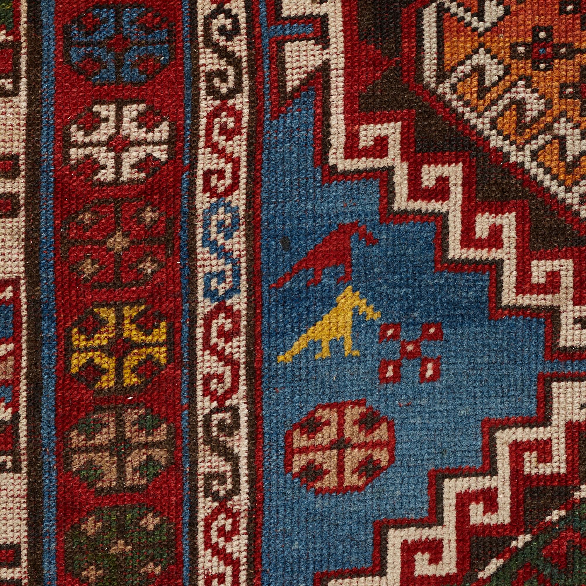 A RUG, a semi-antique Gendje probably, ca 209 x 124 cm.