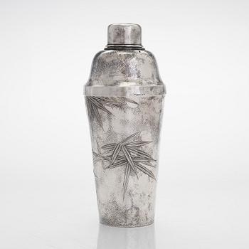 A silver cocktail shaker with strainer, Japan, first half of the 20th century.