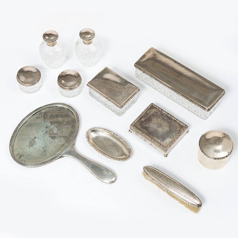 A K.Andersson silver and cut glass 'toilette set', monogrammed 'PG'. (11 pieces).
