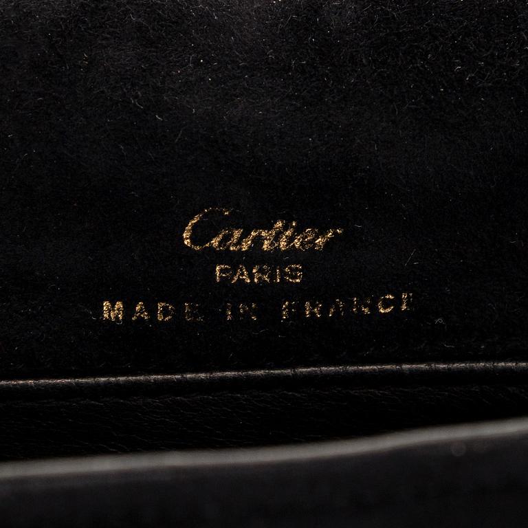 Cartier, a suede bag.