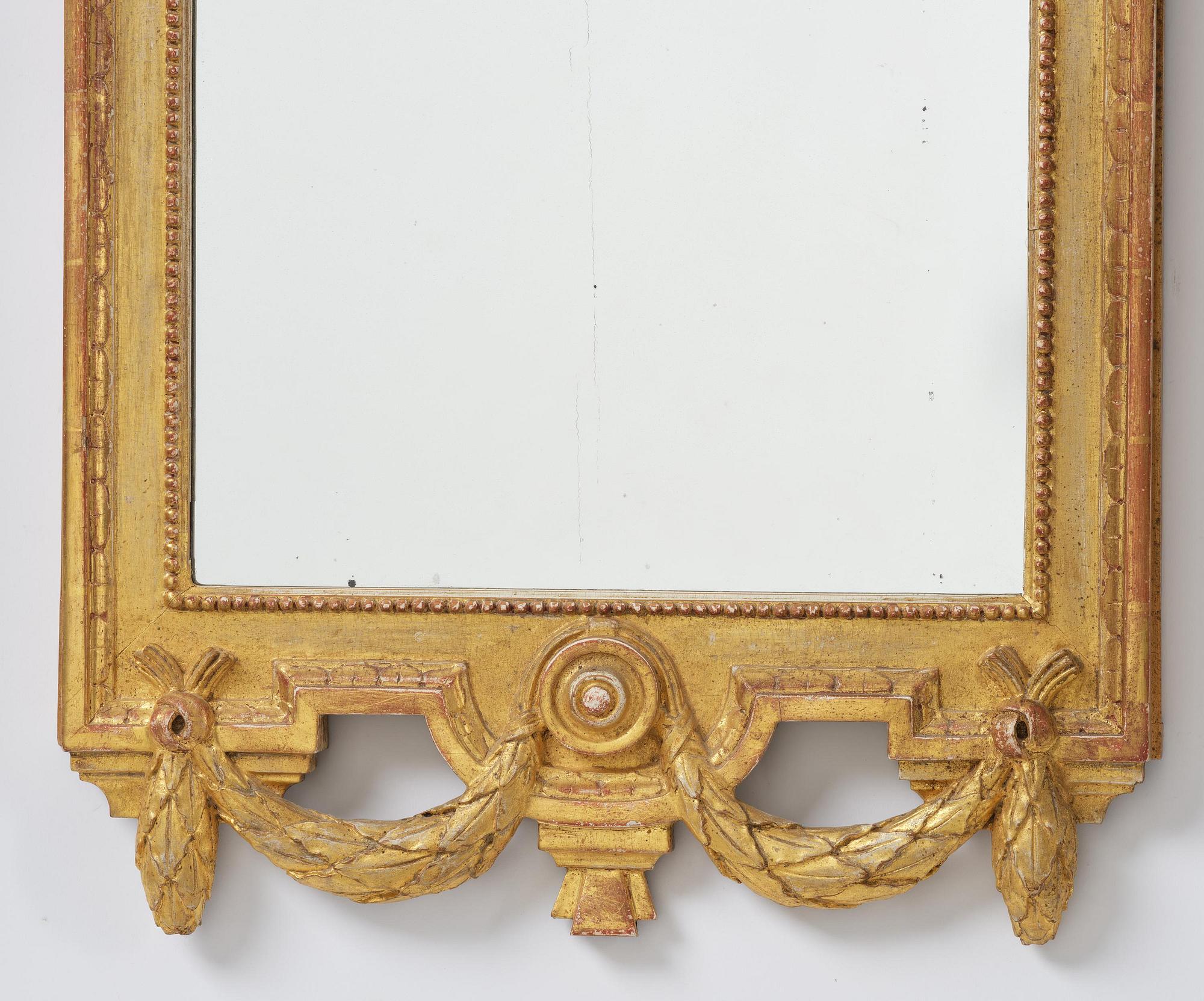 A Gustavian giltwood mirror by J. Åkerblad (master in Stockholm 1758-99).