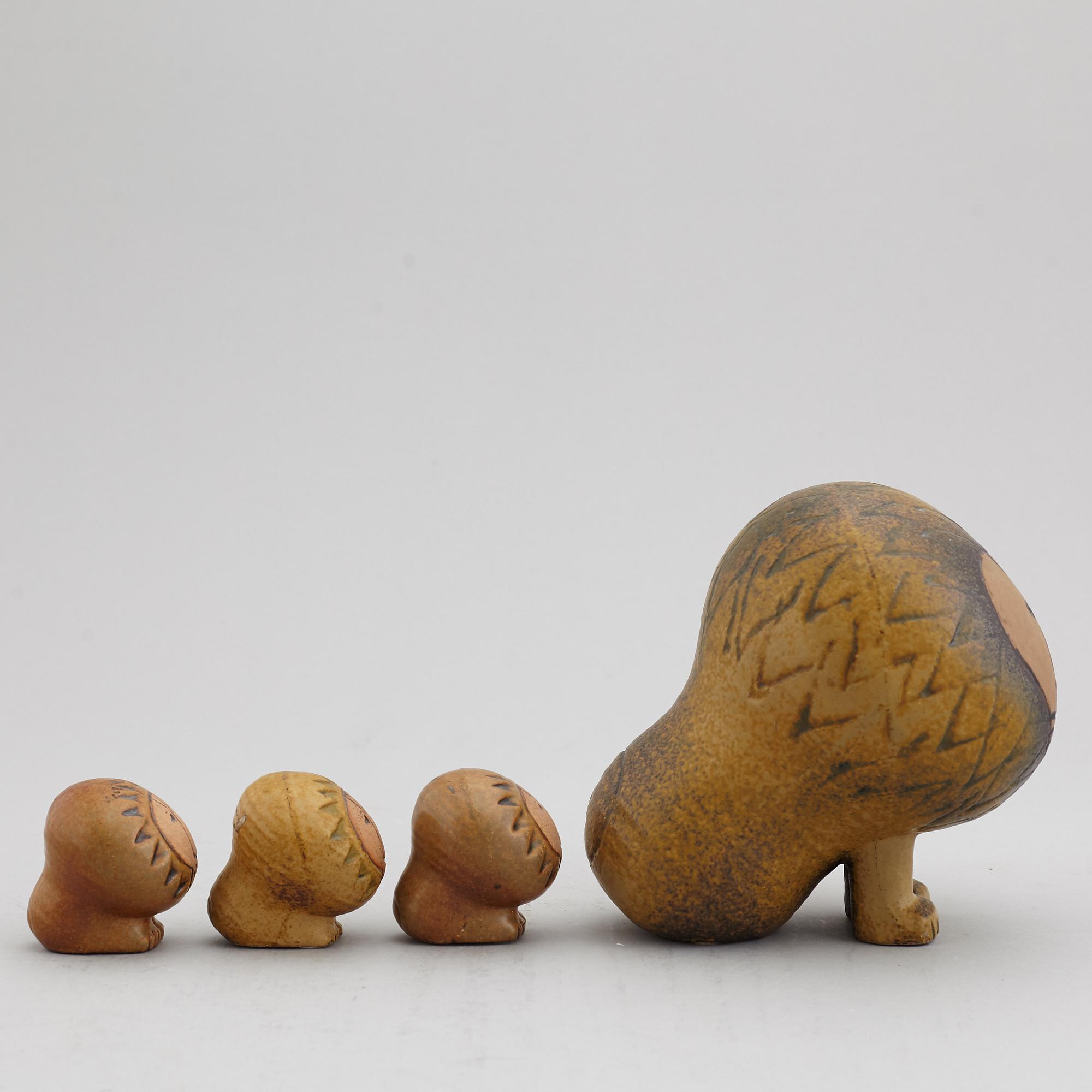LISA LARSON, four stoneware lion figurines, Gustavsberg.
