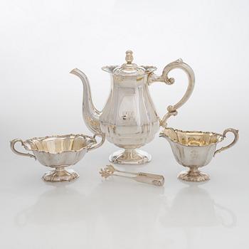 A silver coffee pot, sugar bowl, cream jug, and sugar tongs, Finland 1926-49.