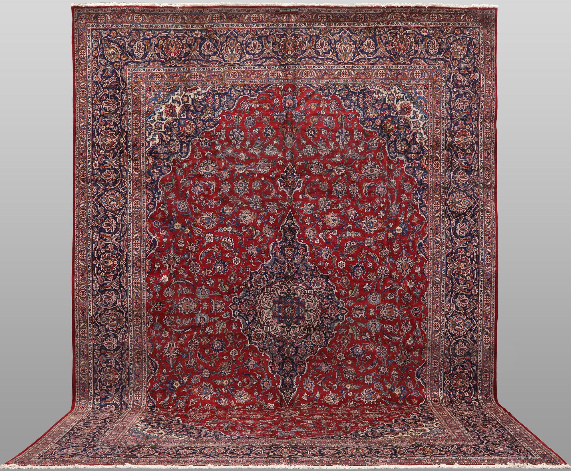A semi-antique Keshan carpet, signed, 449 x 317 cm.