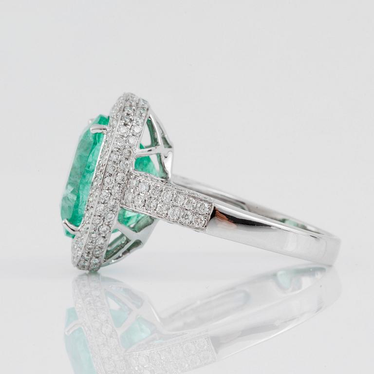 A green beryl, circa 6.00 cts, and diamond, circa 1.30 cts, ring.