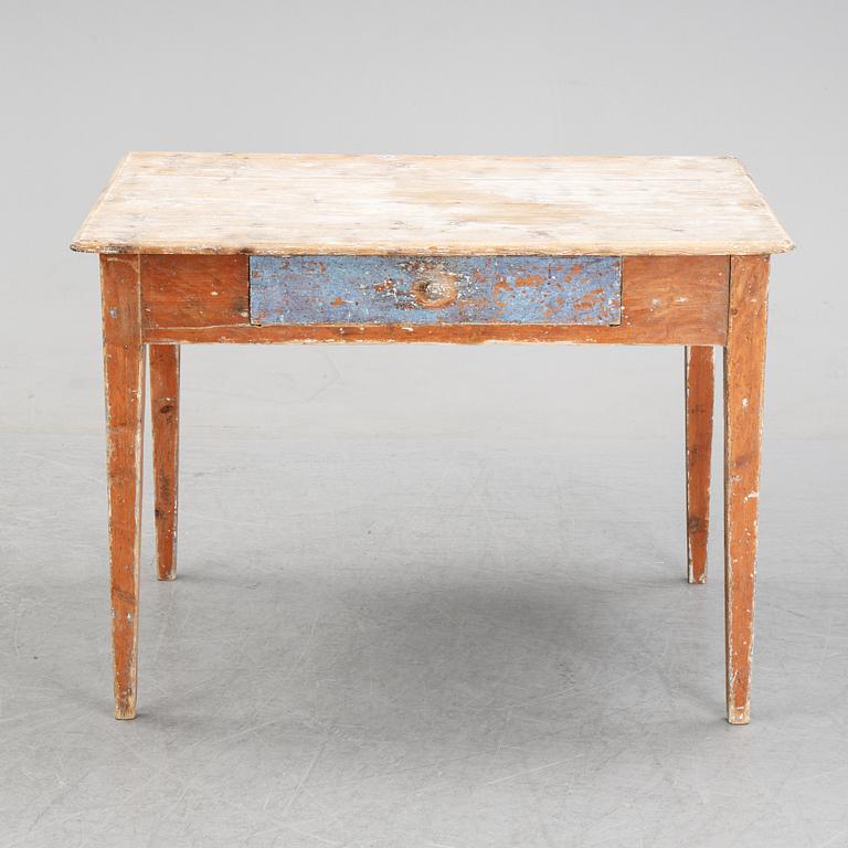 A 19/20th Century table with a drawer.