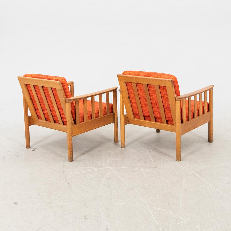 An oak easy chair ans sofa "Tiveden" by Gunnar Myrstrand & Sven Engström from the middle of the 20th century.