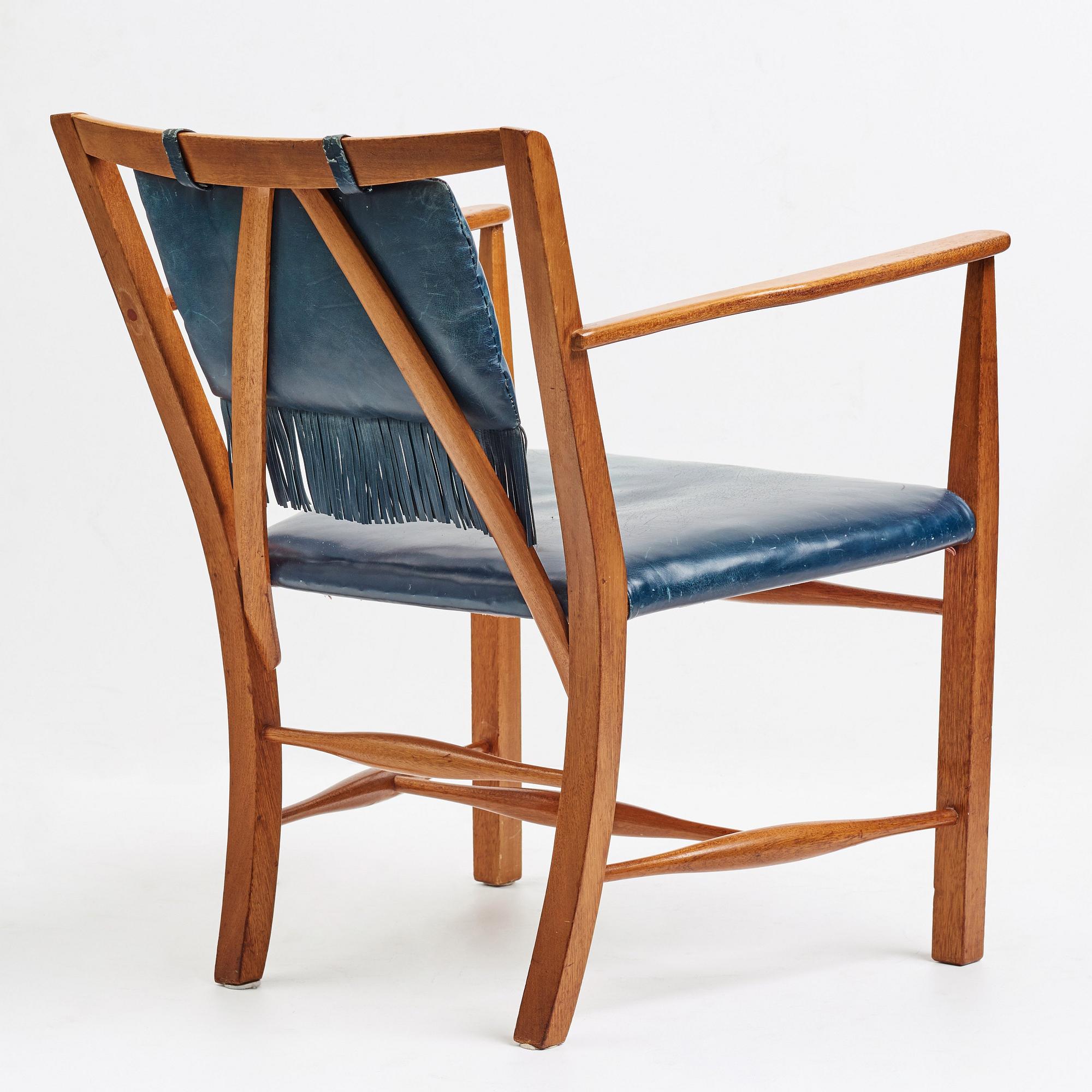 Josef Frank, a mahogany and blue leather chair for Firma Svenskt Tenn, Sweden probably 1950-60's.