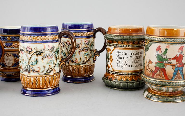 A set of eight majolica mugs from Rörstrand, around the turn of the century 1900.