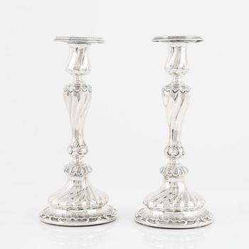 A pair of silver candle sticks by K Anderson Stockholm 1898.