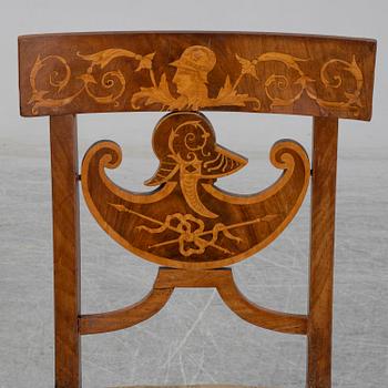 A pair of Royal Empire chairs, first half of the 19th Century.