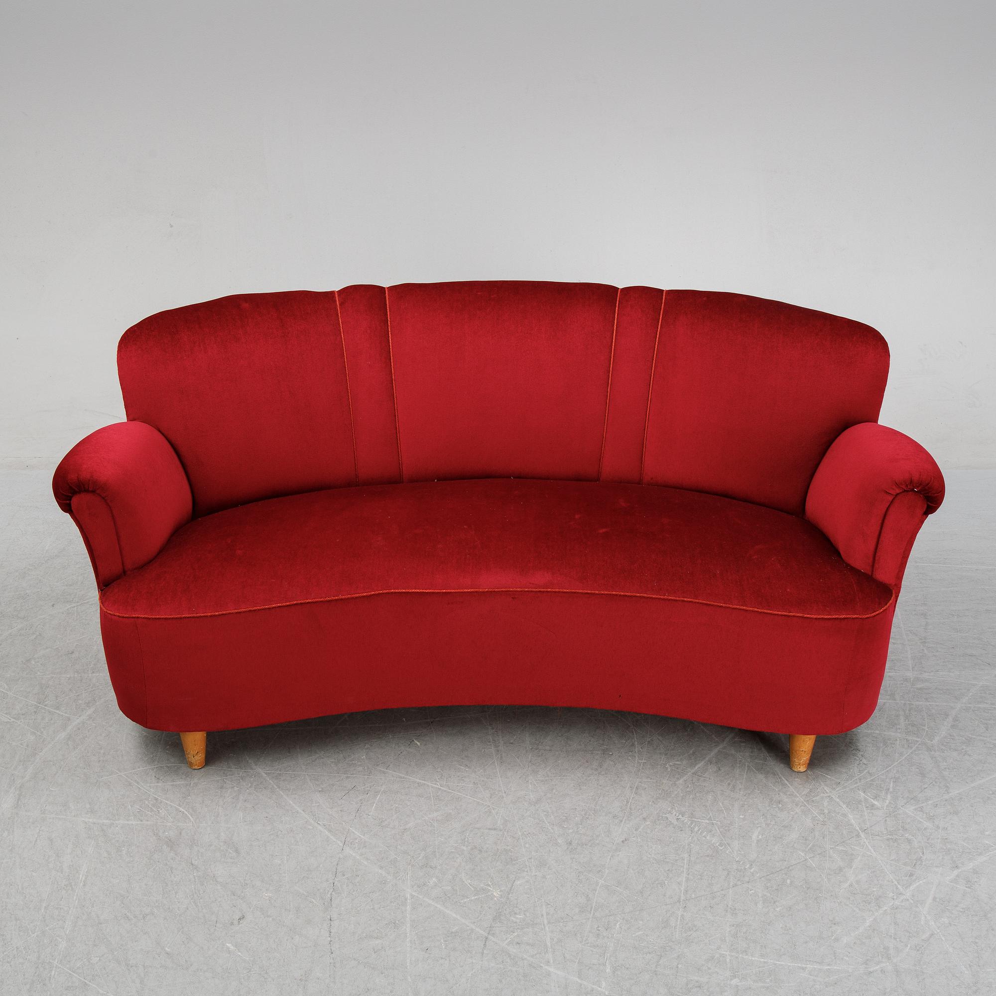 A first half of the 20th Century sofa with velvet upholstery.
