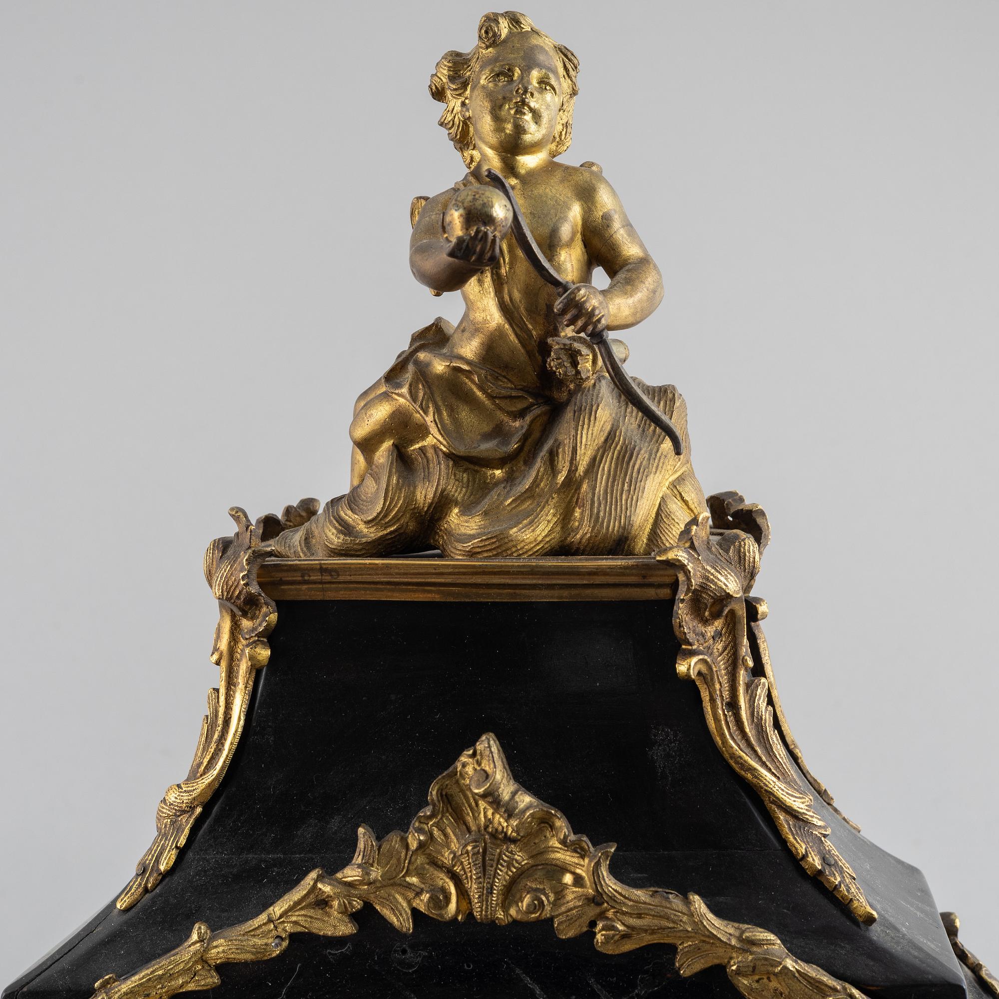 Clock, Rococo style with partially older parts, around the year 1900.